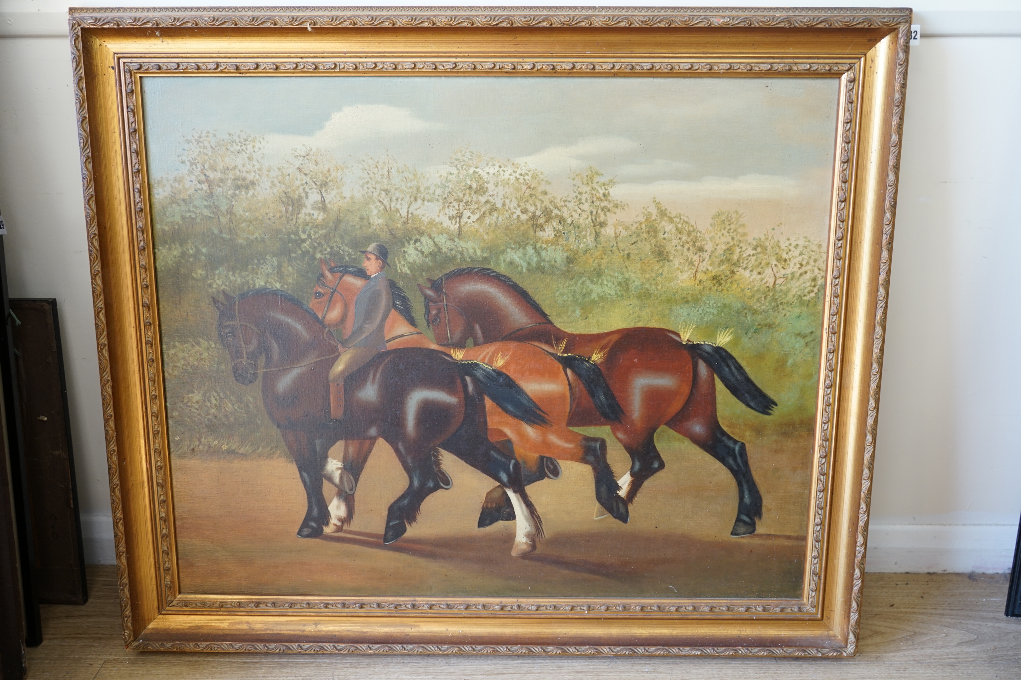 English School, oil on canvas, Naive study of rider leading three Shire horses and a groom, 64 x 80cm. Condition - fair